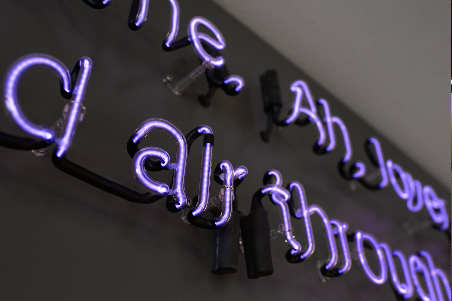 Neon art that hangs in the University Center's lobby.